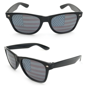 Detail view of black square sunglasses featuring American flag printed lenses with mesh pattern