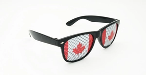 Detail of Canadian flag perforated lenses on black plastic soccer fan sunglasses