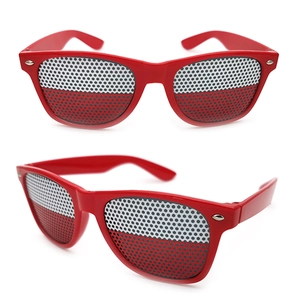 Detail of red party sunglasses with Poland flag pattern on pinhole mesh lenses
