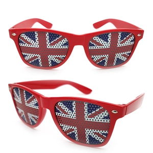 Detail view of red frame party sunglasses with Union Jack flag perforated mesh lenses