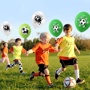 Soccer party balloons set for football theme birthday decorations in outdoor green field