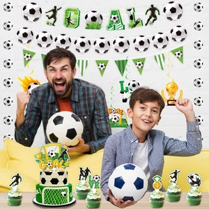 Close-up of World Cup soccer party set with GOAL banner, cake toppers and pennants