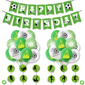 Detail view of soccer birthday party set with banner, balloons and cake toppers