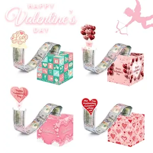 Close-up of heart and checkerboard patterned money pull boxes for romantic gifts