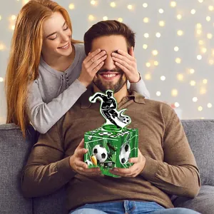 Soccer theme money gift box with football grass patterns and player silhouette topper