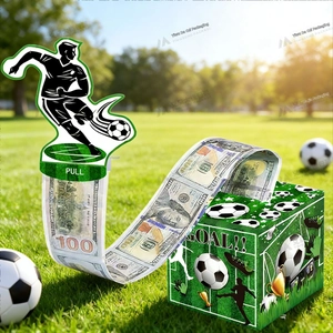 Detail of soccer theme money pull box featuring GOAL text and football player cake topper