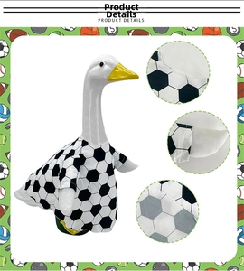 Detail shot of white goose wearing soccer uniform with black and white hexagonal patterns