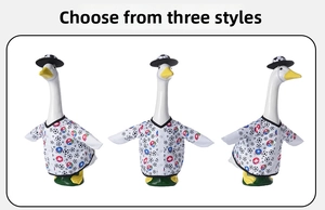 Three-angle view of 23-inch goose lawn ornament in soccer outfit with hat