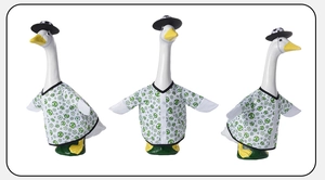 Three angles of 23-inch garden goose outfit with soccer print shirt and black bowler hat
