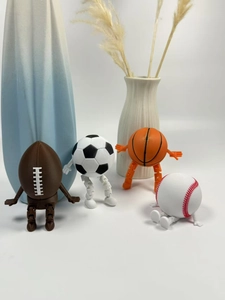 Detailed view of 3D printed poseable sports figures including football and basketball