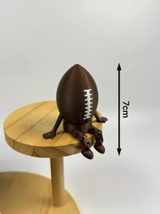 Macro detail of a 7cm 3D printed poseable American football articulated figure