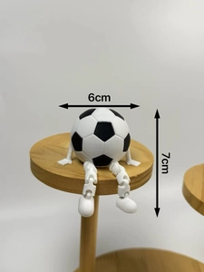 Front view of a 3D printed soccer man figure with movable joints, 6x7cm size
