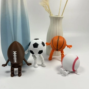 Set of 4 creative sports ball figurines including football, basketball, and baseball
