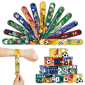 Various colorful 2026 football slap bracelets featuring soccer balls and flags details