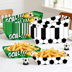 Macro shot of disposable soccer party food trays with goal prints and grass motifs