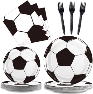 Close-up of black and white soccer themed disposable plates, napkins and plastic forks