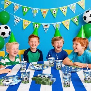 Close-up of boys around a soccer theme party table with paper plates, cups and balloons