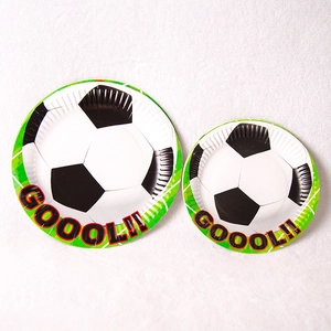 Soccer theme party plates featuring green grass and football designs for birthday decoration