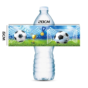 Detail view of soccer-themed water bottle labels with goal and trophy designs