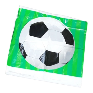 Close-up of football theme plastic gift bag with green white stripes and soccer ball print