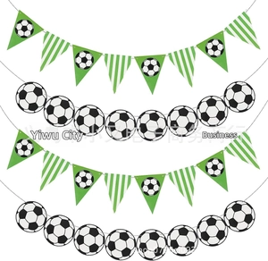 Detail of soccer party bunting banners with football patterns and green stripes