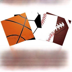 Detail of sports-themed paper napkins with basketball soccer and football prints