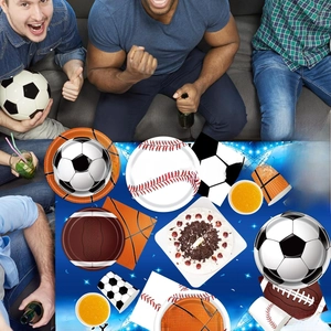 Close-up of assorted sports-themed party tableware sets including paper plates and cups