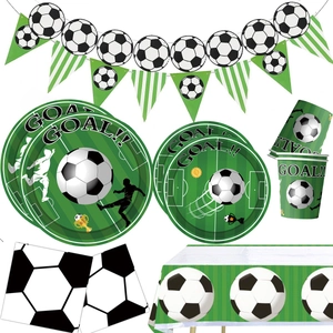 Detailed view of green soccer party set including plates, cups, napkins and goal banners