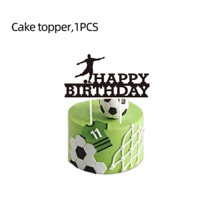 Detail of soccer themed cake topper with Happy Birthday text and player silhouette