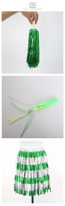 Green and silver metallic tinsel grass skirt with matching party noise makers and tassels