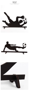 Macro detail of wooden soccer player silhouettes with triangle display stands