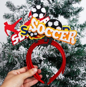 Detail of red soccer themed headband featuring football graphics and soccer player silhouette