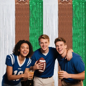 Three-color foil fringe curtain in silver, brown, and green for football party backdrop