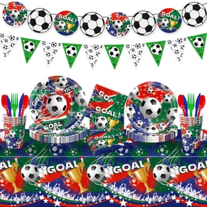 Detailed view of soccer party supplies with plates cups banners and goal napkins