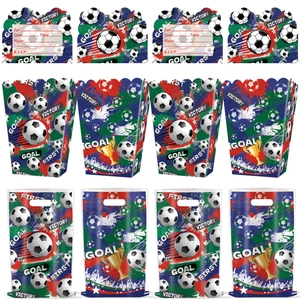Detail view of soccer party invitation cards and gift bags with trophy and goal prints