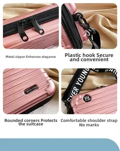 Pink hard shell crossbody bag featuring durable metal double zippers and wide logo strap