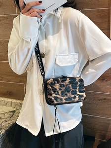 Leopard print hardshell mini crossbody bag with travel suitcase design and woven strap