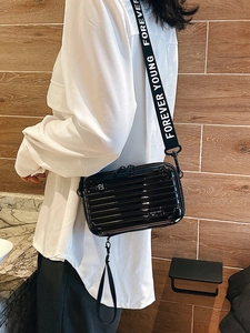 Black hard shell mini suitcase crossbody bag with Forever Young strap and metal logo