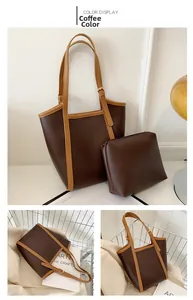 Detail view of large brown tote bag set with matching zipper pouch and gold hardware