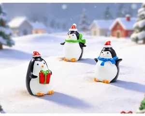 Three miniature Christmas penguins wearing festive hats and scarves on snow background