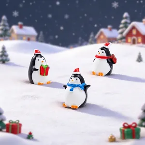 Three Christmas penguin resin miniatures with gift boxes and scarves in a snowy scene