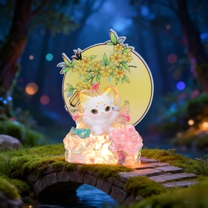 Close-up of a glowing cat night light on a crystal base with a golden moon backdrop