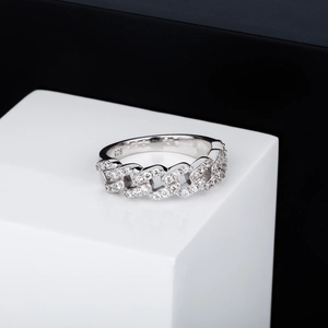 Macro detail of S925 sterling silver Cuban link ring with pavé-set cubic zirconia