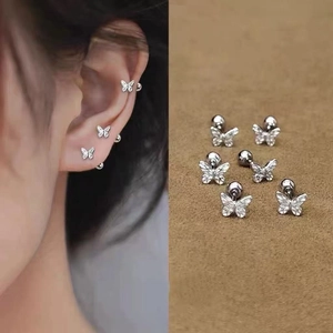 Detailed view of silver butterfly stud earrings with threaded backings and zircon accents