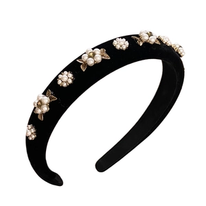 Elegant black velvet headband with white pearl flowers and golden metal leaf accents