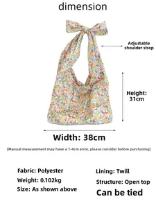 Floral canvas tote bag details with polyester fabric specs and adjustable bow straps