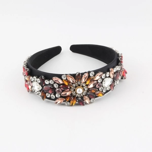 Detailed view of Baroque headband featuring colorful rhinestones and central pearl flower