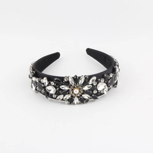Detail of baroque headband featuring crystal flower ornaments and white faux pearl
