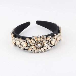 Macro detail of Baroque style headband featuring champagne crystals and a pearl sunflower