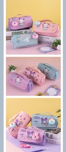 Detail of Sanrio-themed cartoon pencil cases with top handles and donut charms